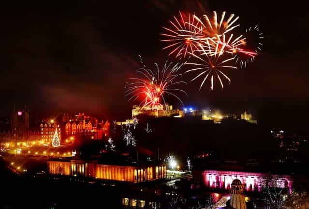Fireworks go off over Edinburgh Castle in Scotland as part of New Year Hogmanay celebrations. (Photo by Danny Lawson/Press Association)
