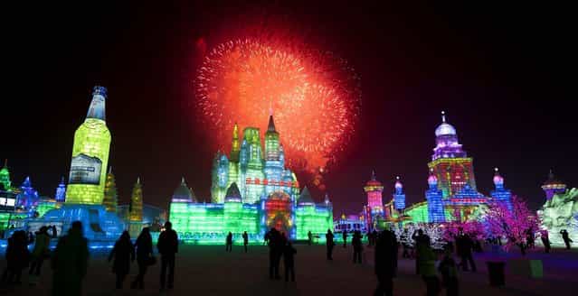Visitors watch fireworks during the opening ceremony of the Harbin International Ice and Snow festival on January 5, 2012. (Photo by Andy Wong/Associated Press)