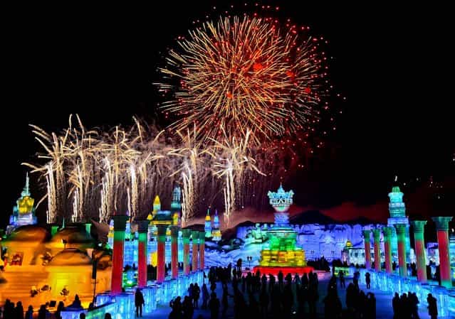 Visitors watch fireworks during the official opening of the 29th Harbin International Ice and Snow Festival on January 5, 2013. (Photo by Associated Press)