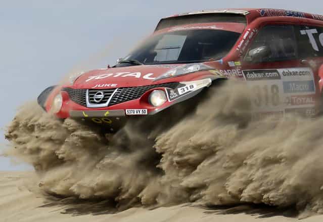 France's Christian Lavieille and co-pilot Jean-Michel Polato compete with their Proto Dessoude during the first stage of the Dakar Rally 2013 from Lima to Pisco January 5, 2013. (Photo by Jacky Naegelen/Reuters)