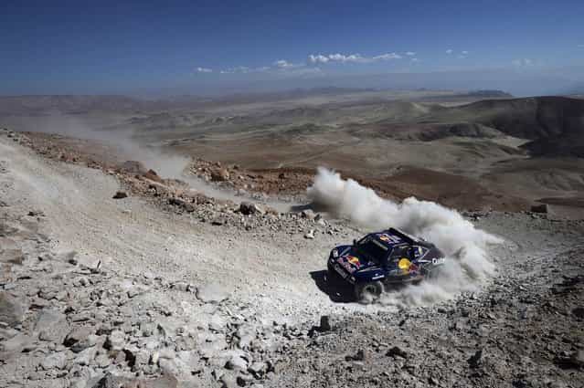 Qatar's Nasser Al-Attiyah and co-pilot Spain's Lucas Cruz compete with their Buggy during the 4th stage of the Dakar Rally 2013 from Nazca to Arequipa, January 8, 2013. (Photo by Franck Fife/Reuters)