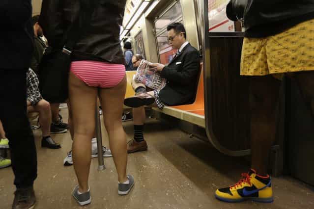 NEW YORK, NY - JANUARY 13: People ride the subway pantless on January 13, 2013 in New York City. Thousands of people participated in the 12th annual No Pants Subway Ride, organized by New York City prank collective Improv Everywhere. During the afternoon winter event, participants boarded separate subway stops and removed their pants, pretending that they did not know each other. The event, refered to as a "celebration of silliness" is designed to make fellow subway riders laugh and smile. (Photo by John Moore/Getty Images)