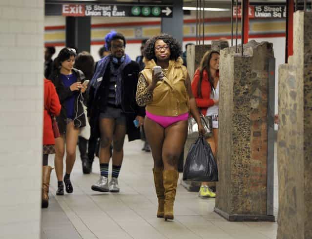 Some riders in the New York City subway in the underwear as the take part in the 2013 No Pants Subway Ride January 13, 2013. Started by Improv Everywhere, the goal is for riders to get on the subway train dressed in normal winter clothes (without pants) and keep a straight face. AFP PHOTO / TIMOTHY A. CLARY (Photo credit should read TIMOTHY A. CLARY/AFP/Getty Images)