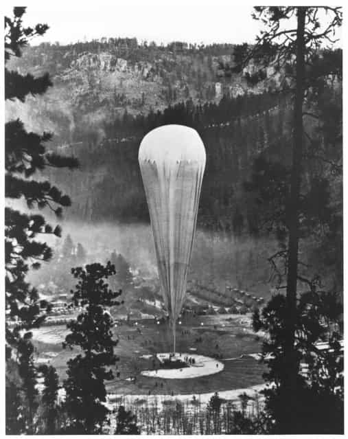 South Dakota, United States, 1935. The National Geographic-Army Air Corps stratosphere balloon Explorer II prepares to rise from the Stratobowl near Rapid City, S.D., on November 11, 1935. It carried two [aeronauts] 72,395 feet (nearly 14 miles) into the stratosphere – the highest men would go for the next 21 years. (Photo by H. Lee Wells