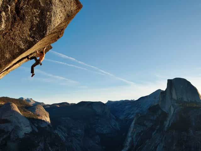 Climbing without a rope in Yosemite National Park, Dean Potter scales a route called [Heaven.] (Photo by Mike Schaefer