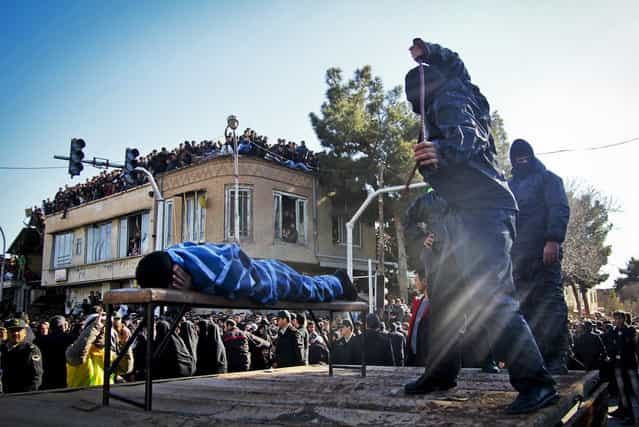 An Iranian officer lashes a man, convicted of rape, at the northeastern city of Sabzevar, Iran, Wednesday, Jan. 16, 2013. Rape, like murder and treason, can be punished by the death sentence in Iran, but sometimes judges imposed a sentence of lashes before execution or imprisonment. (Photo by Hossein Esmaeli/AP Photo)