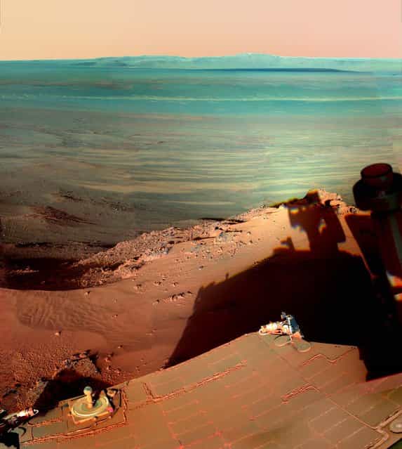 This image provided by NASA shows the late-afternoon shadow cast by the Mars rover Opportunity at Endeavour Crater, January 20, 2013. The six-wheel rover landed on Mars in January 2004 and is still going strong. (Photo by NASA/AP)