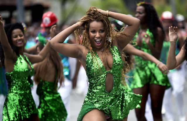Members of the Grande Rio Samba school rehearse at the [Cidade do Samba], or Samba City, in Rio de Janeiro, January 24, 2013. (Photo by Felipe Dana/Associated Press)