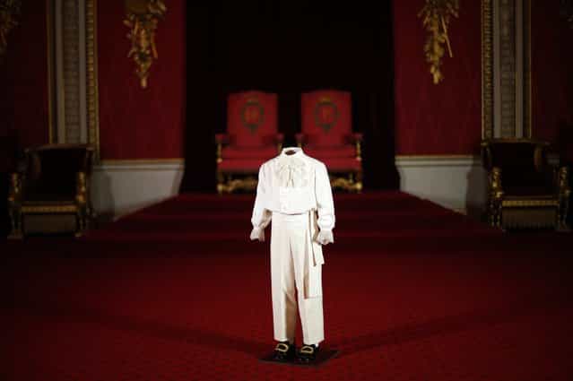 The suit worn by Britain's then-four year old Prince Charles on the day of his mother Queen Elizabeth's coronation is displayed in the throne room at Buckingham Palace during a media preview of this summer's exhibition, in central London, January 24, 2013. This summer's Buckingham Palace exhibition will commemorate the 60th anniverary of Queen Elizabeth's coronation with a collection of dresses, uniforms and robes worn on the day. (Photo by Andrew Winning/Reuters)
