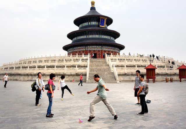 Tourists play Hacky Sack in The Forbidden City. (Photo by Mark Edelson/The Palm Beach Post)