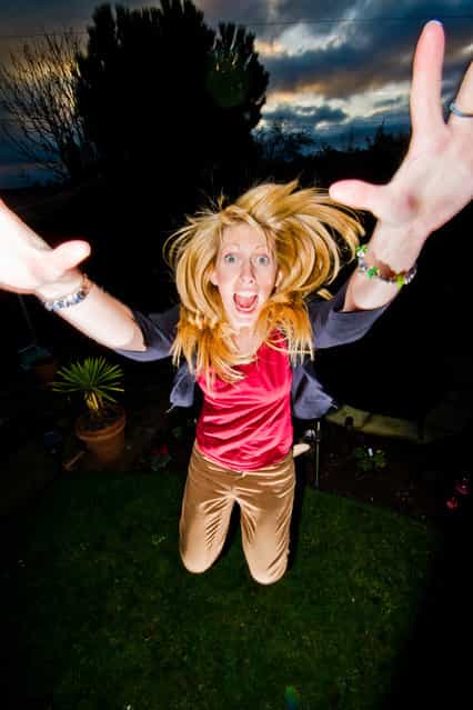 [Jumpology]. [Crazy person jumping in the garden]. (Photo by Alex Turton)