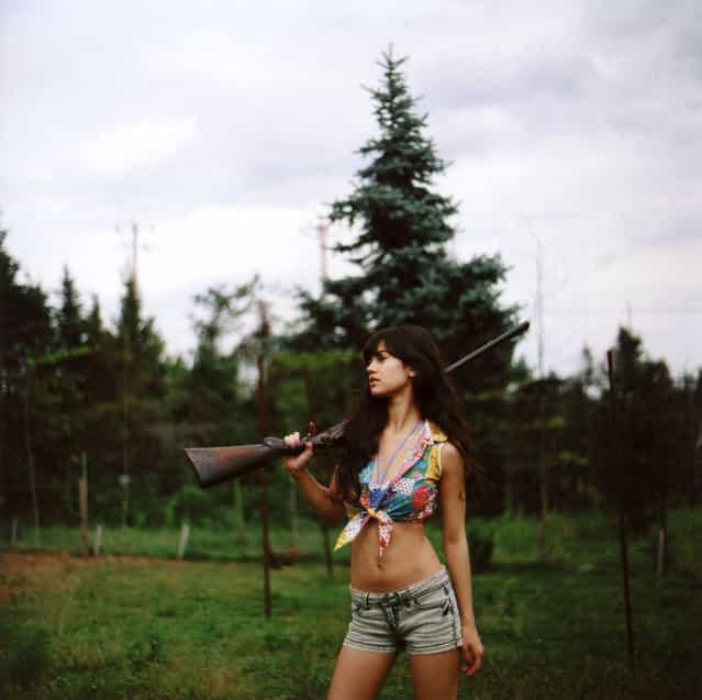 [Aviva and a big gun]. (Photo by Michelle Karpman)