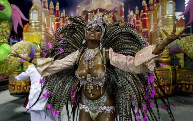A dancer from the X-9 Paulistana samba school performs in Sao Paulo. (Photo by Andre Penner/Associated Press)