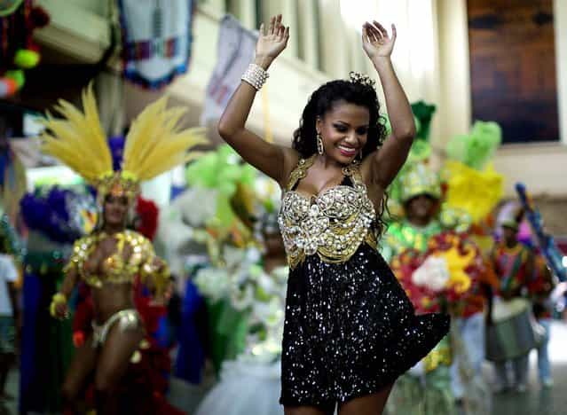 A woman dances at the [Carnaval na Central] carnival block party. (Photo by Felipe Dana/Associated Press)