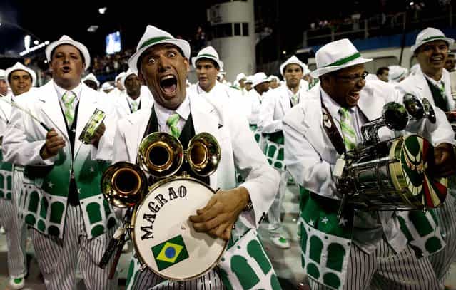 Drummers from the Mancha Verde samba school perform in Sao Paulo. (Photo by Andre Penner/Associated Press)
