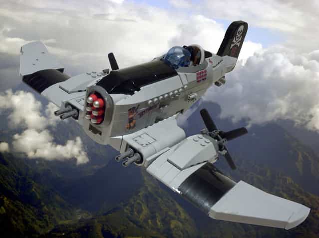[P-23 Skywolf. Sky pirate Grant [Mad Dog] Hendricks piloting his P-23 Skywolf. A member of the feared Crossbones Gang they terrorised air shipping, stealing cargo and holding passengers for ransom until Hendricks was finally shot down by flying ace Betty Redwing with a lucky shot to the nose! The rest of the gang were rounded up and imprisoned except for "Ratface" Watkins who escaped and was never found. The plane was originally developed for the Kovlakian Air Force and carried six [Hades] shrapnel missiles but after several incidents of its missiles misfiring and blowing up the plane, they were quietly scrapped. A few found their way onto the black market where they were snapped up by sky pirates for whom their safety record wasn't a problem...]. (Jon Hall)