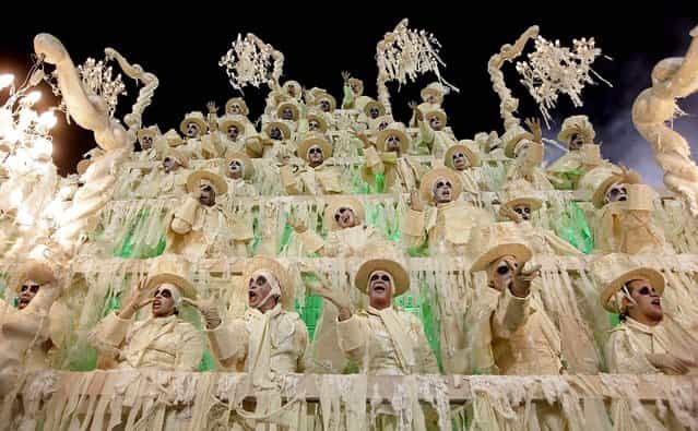 Performers from the Unidos da Tijuca samba school parade during carnival celebrations at the Sambadrome in Rio de Janeiro. (Photo by Hassan Ammar/Associated Press)