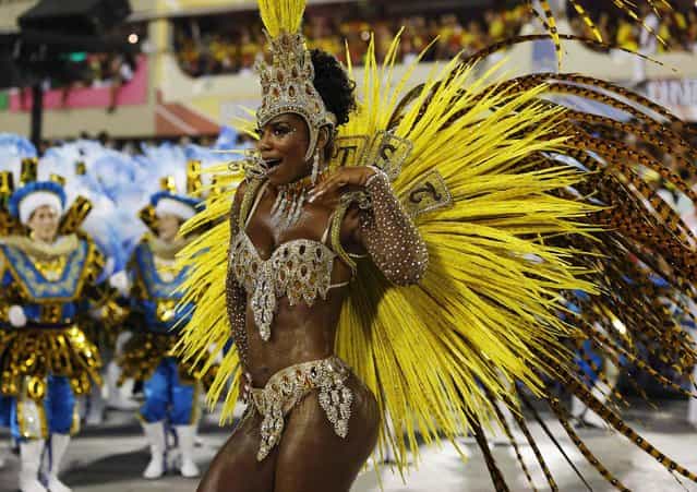 A reveller of the Unidos da Tijuca samba school participates in the annual carnival parade at Rio de Janeiro's Sambadrome February 10, 2013. (Photo by Sergio Moraes/Reuters)