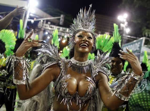 Drum Queen Camila Silva of the Mocidade Independente samba school dances on the first night of the annual Carnival parade in Rio de Janeiro's Sambadrome, February 11, 2013. (Photo by Pilar Olivares/Reuters)