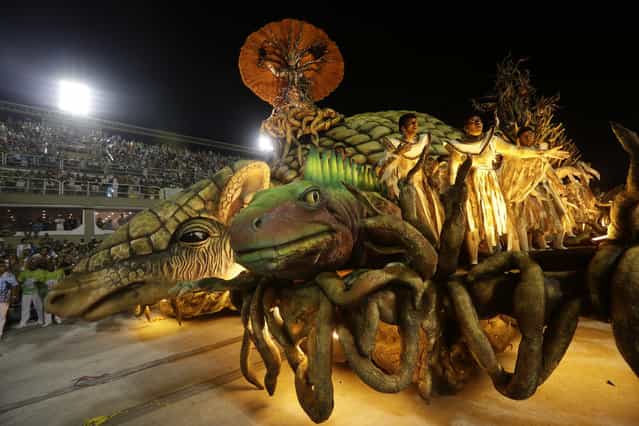 Performers from the Unidos de Vila Isabel samba school parade during Carnival celebrations at the Sambadrome in Rio de Janeiro, Tuesday, February 12, 2013. Rio de Janeiro's samba schools vied for the title of the year's best in an over-the-top, all-night-long Carnival parade at the city's iconic Sambadrome. (Photo by Silvia Izquierdo/AP Photo)