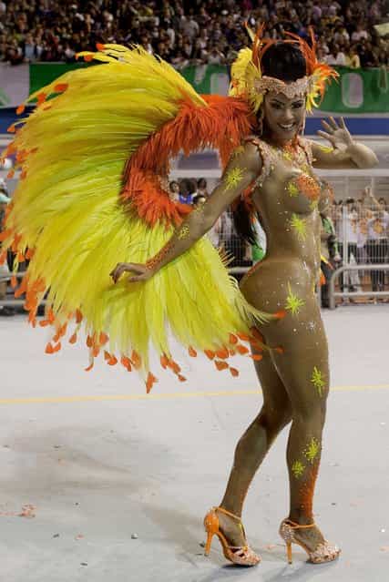 A dancer from the Mancha Verde samba school performs in Sao Paulo. (Photo by Andre Penner/Associated Press)