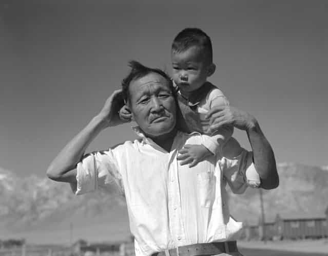 [Manzanar Relocation Center, Manzanar, California, July 2, 1942. Grandfather and grandson of Japanese ancestry at the War Relocation Authority center]. (Photo by Dorothea Lange)