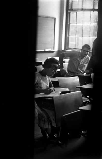September 1963, Patricia Marcus, left, sits in a nearly abandoned classroom at West End High School in September 1963. Most of the school's student body boycotted Marcus' and Josephine Powell's integration of their school. (Photo by Robert Adams/The Birmingham News)