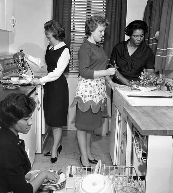 In this March 1963 file photo, black and white students participate in a home economics class at West Virginia State College at Institute, W.Va. The school, one of a number in which reverse integration is taking place, has changed from a predominantly African-American college to one with 65-to-70 per cent white students in its student body of 2,502. (Photo by AFP Photo)