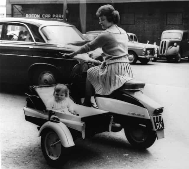 A new design from the makers of Lambretta Scooters, 9th May 1963. Anita White of Teddington rides a power-driven pram with her daughter, Anita. (Photo by Keystone)