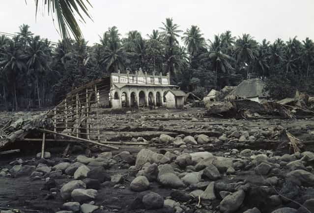After the eruption of Mount Agung in Bali, on March 26, 1963, most of the cabins have been destroyed in this village. On March 17, the volcano erupted, sending debris into the air and generating massive pyroclastic flows. These flows devastated numerous villages, killing approximately 1,500 people. (Photo by AP Photo)