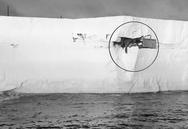 Admiral Richard Byrd's [Little America III] station, built in Antarctic in 1940, was spotted by a Navy icebreaker sticking out of the side of this floating iceberg in the Antarctic's Ross Sea, on March 13, 1963. The old outpost was buried beneath 25 feet of snow, 300 miles away from its original location. A helicopter pilot flew in close and reported cans and supplies still stacked neatly on shelves. (Photo by AP Photo/Official U.S. Navy Photo)