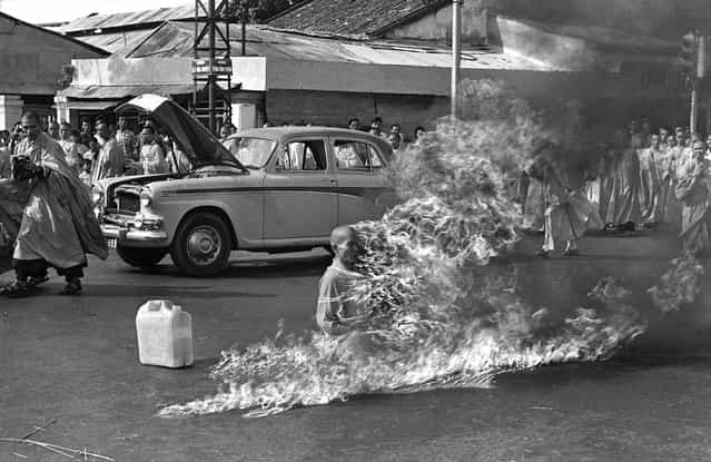 Thich Quang Duc, a Buddhist monk, burns himself to death on a Saigon street to protest alleged persecution of Buddhists by the South Vietnamese government, on June 11, 1963. (Photo by Malcolm Browne/AP Photo)