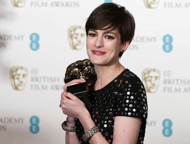 Anne Hathaway celebrates after winning the Best Supporting Actress award for [Les Miserables] at the British Academy of Film and Arts (BAFTA) awards ceremony at the Royal Opera House in London February 10, 2013. (Photo by Suzanne Plunkett/Reuters)