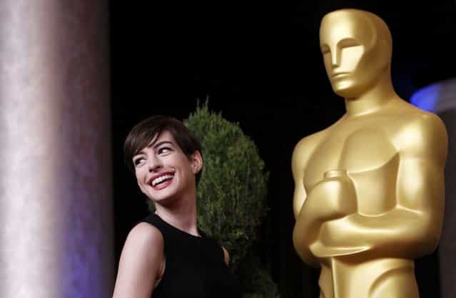 Actress Anne Hathaway, nominated for best supporting actress for her role in [Les Miserables], poses at the 85th Academy Awards nominees luncheon in Beverly Hills, California February 4, 2013. (Photo by Mario Anzuoni/Reuters)