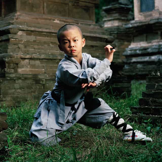 Hao Han (8), Shaolin kung fu student and child actor. Shaolin Monastery, Henan. (Photo by Mathias Braschler and Monika Fischer)