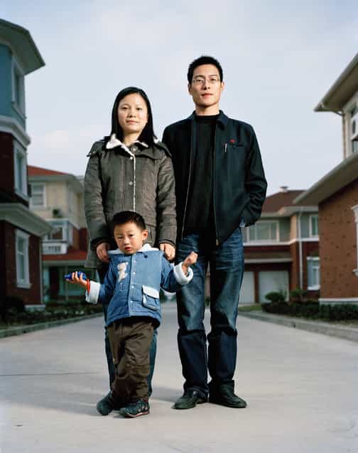 Sun Liping (28), Huang Kunhua (27) and Huang Jingxuan (4). Accountant (Sun), Administrator (Huang). One Child Family in the richest village of China. Huaxi, Jiangsu. (Photo by Mathias Braschler and Monika Fischer)