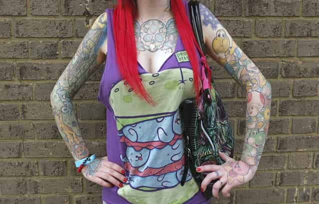 Sophie Lenton from Bracknell poses for a portrait in Brighton, southern England February 16, 2013. Brighton hosts [The Brighton Tattoo Convention] this weekend, an annual two-day gathering which attracts visitors, performers and tattoo artists from around the world. Photograph taken February 16, 2013. (Photo by Toby Melville/Reuters)
