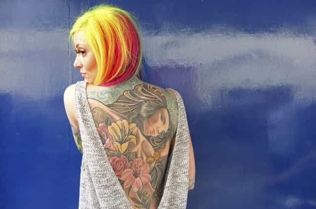 Helen Taylor from Stoke-upon-Trent poses for a portrait in Brighton, southern England February 16, 2013. Brighton hosts [The Brighton Tattoo Convention] this weekend, an annual two-day gathering which attracts visitors, performers and tattoo artists from around the world. Photograph taken February 16, 2013. (Photo by Toby Melville/Reuters)