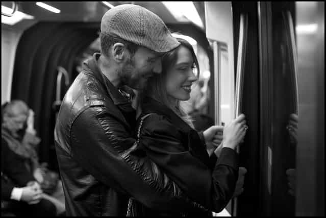 Paris grace. Gina and Jose ride home together at the end of a day on the Paris metro. (Photo and comment by Peter Turnley)