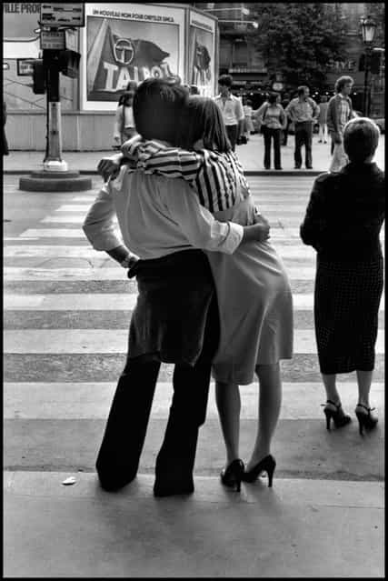 The body language of love. A couple waiting to cross the Boulevard St. Michel in the Latin Quarter, Paris. I wish so much I could find this couple today, where ever they are, and whatever the circumstances of their lives-this is a moment they'd want to remember. 1978. (Photo and comment by Peter Turnley)
