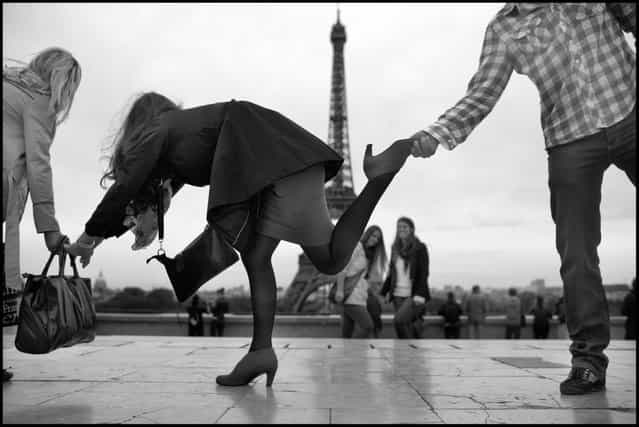 The Eiffel Tour-the body language of balance. I came across this group of young adults from Sarajevo, Bosnia, having fun testing their balance two nights ago in on the Esplanade de Trocadero. (Photo and comment by Peter Turnley)