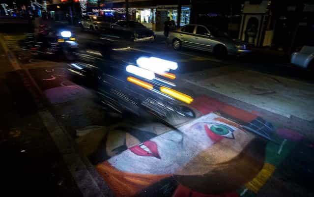 Sunday night the artists are gone and traffic returns to Lake and Lucerne Avenues in downtown Lake Worth. (Photo by Thomas Cordy/The Palm Beach Post)