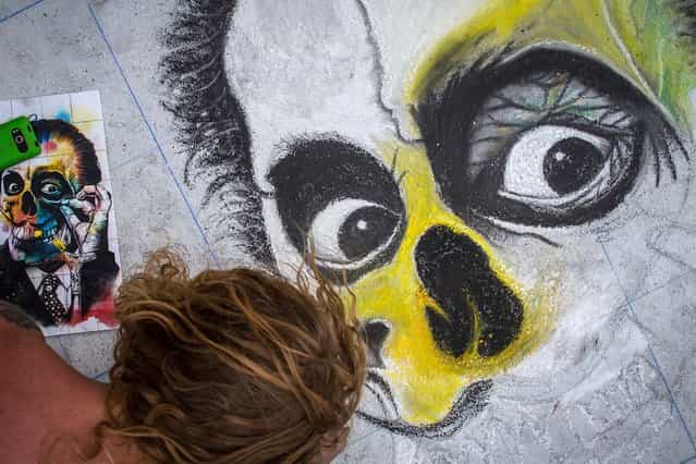 Mike O'Keefe of Lake Worth works on a Salvador Dali self-portrait at the Lake Worth Street Painting Festival. (Photo by Thomas Cordy/The Palm Beach Post)