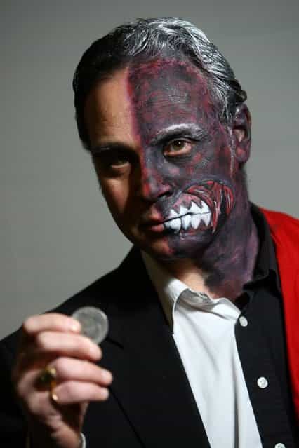 An actor dressed as Two-Face from the film Batman poses for a photo at the London Super Comic Convention at the ExCeL Centre on February 23, 2013 in London, England. Enthusiasts at the Comic Convention are encouraged to wear a costume of their favourite comic character and flock to the ExCeL to gather all the latest news in the world of comics, manga, anime, film, cosplay, games and cult fiction. (Photo by Jordan Mansfield)
