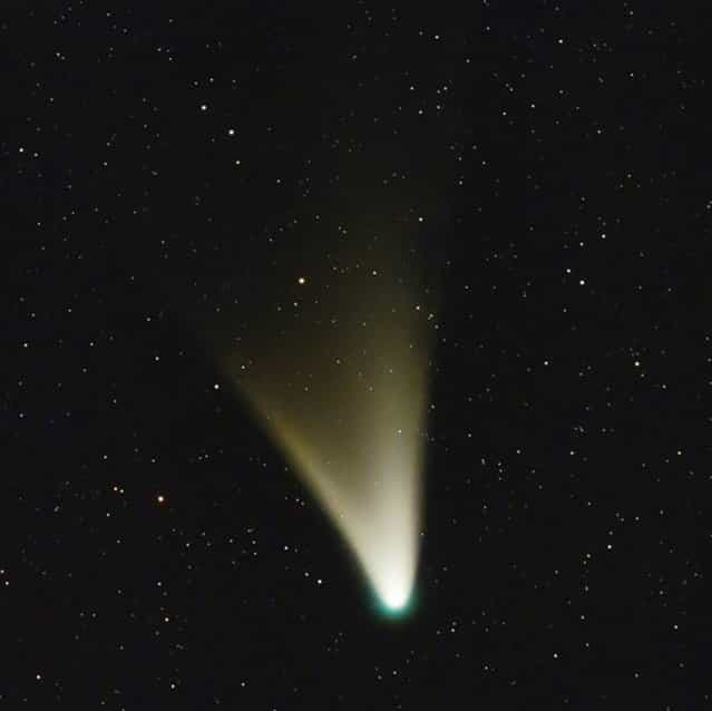 Comet PanSTARRS glows with a fanlike tail in this image captured by Argentine astrophotographer Ignacio Diaz Bobillo on February 15, 2013. The comet is expected to reach naked-eye visibility in the Northern Hemisphere in early March. (Photo by Ignacio Diaz Bobillo/Pampaskies.com)