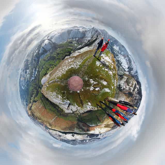 [Summit orientation plate is in the centre. Mam Tor just left of top, Kinder and Edale on top right, Bleaklow and rest of the Dark Peak bottom right, Hope Valley and village on bottom left, Castleton and White Peak on top left]. ([Little Planets] Project. Photo and comment by Dan Arkle)