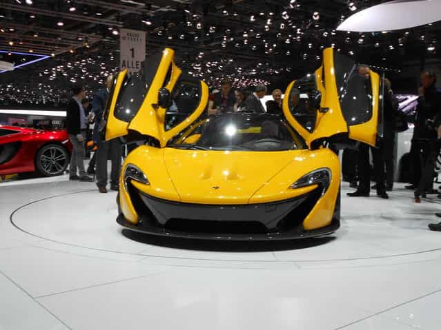 McLaren P1. P1 will cost $1.15 million. Production limited to 375 units. 727 horsepower from gas engine, 176 hp from electric. The production version of McLaren's P1 supercar has been revealed at the 2013 Geneva Auto Show. Finished in bright yellow, the road-ready P1 features a hybrid V8, gull wing doors and a host of high-performance features. (Photo by Luis Fernando Ramos/G1)