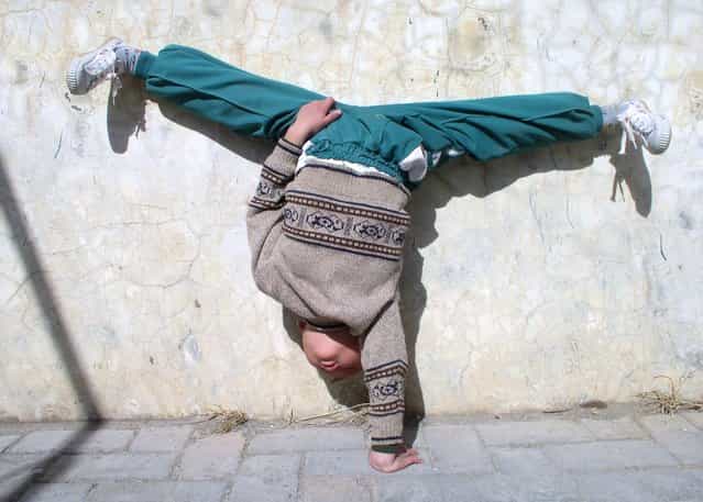 Young kung fu student at Shaolin Temple, Henan. (Photo by Tom Carter/The Atlantic)