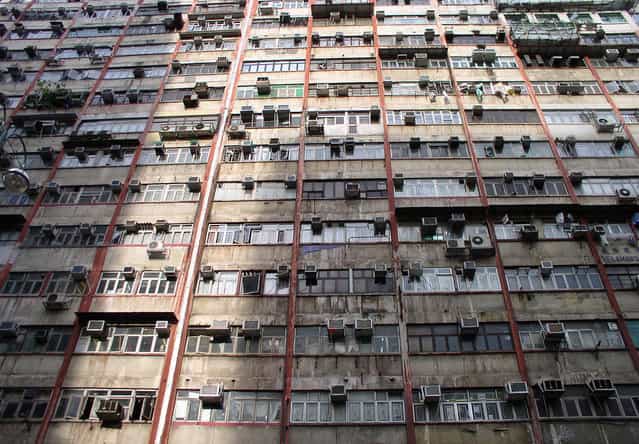 Facade of the infamous Chungking Mansions, Hong Kong's [mmigrant ghetto]. (Photo by Tom Carter/The Atlantic)