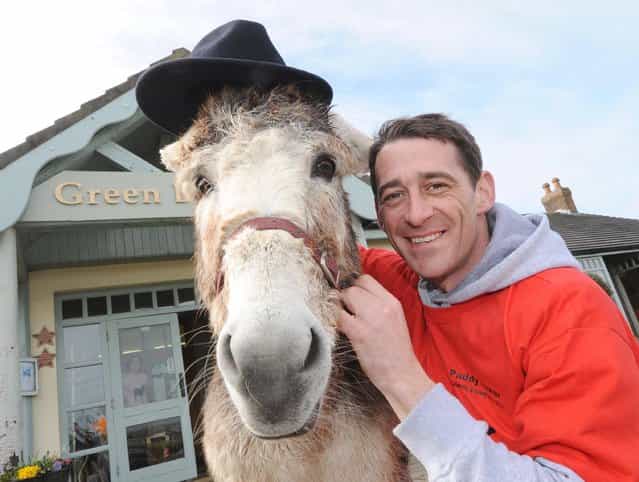Davy Russell, the Irish champion jockey, with one of the donkeys, Sarkozy Browne, for the Paddy Power Celebrity Donkey Derby in Youghal, March 22, 2013, to raise funds for the Queen of the Sea Festival (July 12th-14th) which in turn will benefit Youghal lifeboat and Childline. (Photo by Denis Minihane)